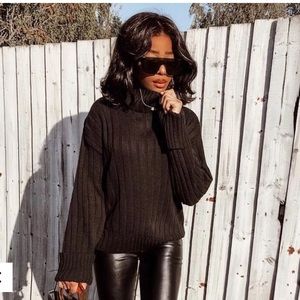 Cropped black turtleneck sweater